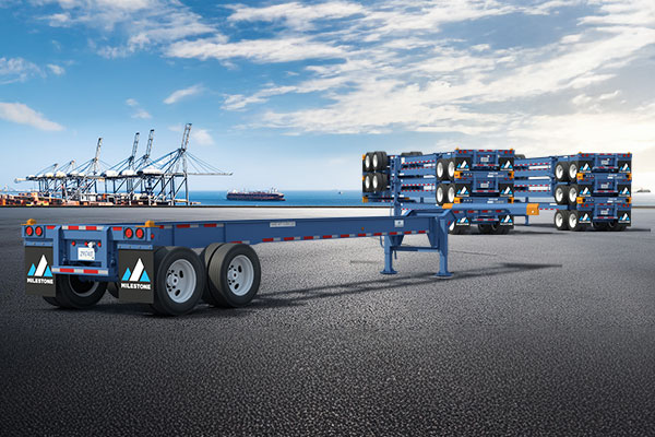 Blue Milestone chassis trailer at a shipping port, emphasizing container chassis leasing for port and intermodal logistics.